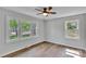 Bedroom featuring natural light, hardwood floors, and a ceiling fan at 506 E Maine Ave, Bessemer City, NC 28016