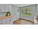 Bright laundry room features storage cabinets and a window with a backyard view at 506 E Maine Ave, Bessemer City, NC 28016