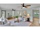 Bright living room features hardwood floors, stylish decor, and contemporary ceiling fans at 506 E Maine Ave, Bessemer City, NC 28016