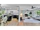 Open-concept floor plan with modern kitchen, living room, and hardwood floors at 506 E Maine Ave, Bessemer City, NC 28016