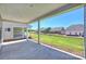 Back porch with an open view of the lawn and neighborhood at 6043 Waldorf Ave, Monroe, NC 28110