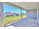 Back porch with an open view of the lawn and neighborhood at 6043 Waldorf Ave, Monroe, NC 28110