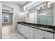 Bathroom showcasing dual sinks, granite countertops, and a modern frameless shower at 6043 Waldorf Ave, Monroe, NC 28110