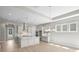 Open kitchen with a large island, pendant lighting, and stainless steel appliances at 6043 Waldorf Ave, Monroe, NC 28110