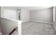 Upstairs loft with neutral paint and plush carpeting at 6043 Waldorf Ave, Monroe, NC 28110