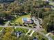 Community aerial featuring a pool, clubhouse, and lush landscaping in a residential neighborhood at 831 Lake Forest Dr # Savanh, Belmont, NC 28012