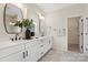 Modern bathroom featuring dual sinks, a decorative mirror, and white cabinetry at 831 Lake Forest Dr # Savanh, Belmont, NC 28012