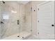 Bathroom featuring a glass enclosed shower with white subway tile and a bench at 831 Lake Forest Dr # Savanh, Belmont, NC 28012