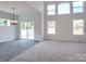 Open concept living space with tile and carpet floors with natural light at 831 Lake Forest Dr # Savanh, Belmont, NC 28012