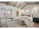 Stylish primary bedroom with vaulted ceilings, an ensuite sitting room, and wood floors at 831 Lake Forest Dr # Savanh, Belmont, NC 28012