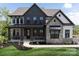 Beautiful two-story home with a stone facade, covered porch, and well-manicured landscaping at 841 Lake Forest Dr # Hawthorne, Belmont, NC 28012