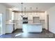 Spacious kitchen with white cabinets, a large island, stainless steel appliances, and modern pendant lighting at 841 Lake Forest Dr # Hawthorne, Belmont, NC 28012