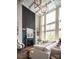 Bright living room featuring large windows, a cozy fireplace, and a comfortable white sectional at 841 Lake Forest Dr # Hawthorne, Belmont, NC 28012
