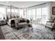 Cozy main bedroom boasts natural light, balcony access, and stylish decor at 841 Lake Forest Dr # Hawthorne, Belmont, NC 28012