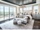 Luxurious bedroom featuring a tray ceiling, chandelier, and access to an outdoor balcony at 841 Lake Forest Dr # Hawthorne, Belmont, NC 28012