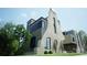 Rear view of modern home with stone and wood at 715 Charles Ave, Charlotte, NC 28205