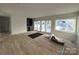 Recreation room with hardwood floors and sliding glass doors at 715 Charles Ave, Charlotte, NC 28205