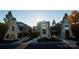 Three modern townhouses with unique stone and wood exteriors at 719 Charles Ave, Charlotte, NC 28205