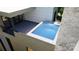 Private rooftop pool with granite coping and modern tile deck at 719 Charles Ave, Charlotte, NC 28205