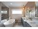 Beautiful bathroom with a soaking tub, dual sinks, and stylish tile, offering a serene retreat at 843 Lake Forest Dr # Devonshire, Belmont, NC 28012