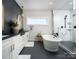 Well-designed bathroom with a soaking tub, dual vanities, and a modern shower, creating a spa-like experience at 843 Lake Forest Dr # Devonshire, Belmont, NC 28012