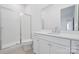 Modern bathroom with white tile, vanity and shower at 5217 Glenwalk Dr # 0059, Charlotte, NC 28269