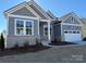 Gray and white two-story house with a two-car garage at 5217 Glenwalk Dr # 0059, Charlotte, NC 28269