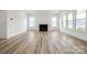 Spacious living room featuring hardwood floors and a fireplace at 5217 Glenwalk Dr # 0059, Charlotte, NC 28269