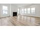 Bright living room with fireplace and hardwood floors at 5217 Glenwalk Dr # 0059, Charlotte, NC 28269