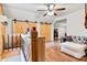Upstairs bonus room features a seating area and sliding barn doors at 6051 Pointe West Ln, Vale, NC 28168