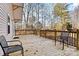 Wooden deck with chairs and a wooded view provides an outdoor area for relaxation and enjoyment at 6051 Pointe West Ln, Vale, NC 28168