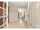 Inviting entryway showcasing hardwood floors and a glimpse into the living space at 6051 Pointe West Ln, Vale, NC 28168