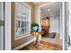 Inviting entryway featuring a decorative table and window, leading to the dining area at 6051 Pointe West Ln, Vale, NC 28168