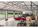 Spacious garage featuring multiple vehicles, including classic cars and motorcycles, ideal for collectors at 6051 Pointe West Ln, Vale, NC 28168