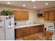 Functional kitchen with countertops, wooden cabinetry, and a dining table for casual meals at 6051 Pointe West Ln, Vale, NC 28168