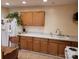 Simple kitchen featuring wooden cabinets, countertops, and a dining area, perfect for cozy meals at 6051 Pointe West Ln, Vale, NC 28168
