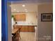 Cozy kitchen with wooden cabinets, countertops, and a dining area for casual meals at 6051 Pointe West Ln, Vale, NC 28168