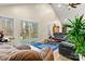 Spacious living room featuring vaulted ceiling, sliding glass doors, and natural light at 6051 Pointe West Ln, Vale, NC 28168