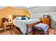 Comfortable main bedroom boasts a large bed and wooden decor, creating a cozy and inviting atmosphere at 6051 Pointe West Ln, Vale, NC 28168