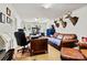 Well-lit office area with a spacious desk, comfortable seating, and unique wall decor for inspiration at 6051 Pointe West Ln, Vale, NC 28168