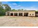 Large outbuilding with multiple garage doors offering ample space for storage and hobbies at 6051 Pointe West Ln, Vale, NC 28168