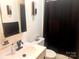 A standard bathroom with a combination shower and bathtub and single sink vanity at 2535 Fairfax Dr, Gastonia, NC 28054