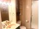 Bathroom with a mirrored vanity, shelving, a toilet and a glass shower at 2535 Fairfax Dr, Gastonia, NC 28054