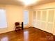 This bedroom has two large windows, hardwood floors and a large closet at 2535 Fairfax Dr, Gastonia, NC 28054