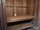 This closet boasts wood shelving providing ample storage space at 2535 Fairfax Dr, Gastonia, NC 28054