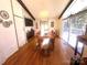 Elegant dining room with hardwood floors, a large table, and a window overlooking a backyard at 2535 Fairfax Dr, Gastonia, NC 28054