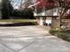 View of concrete driveway and side of home with yard at 2535 Fairfax Dr, Gastonia, NC 28054