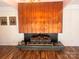 Living room featuring a standout metal fireplace surround with a unique dark brick hearth, and a wood mantel at 2535 Fairfax Dr, Gastonia, NC 28054