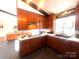 Charming kitchen features wood cabinets, modern appliances, tile flooring and lots of natural light at 2535 Fairfax Dr, Gastonia, NC 28054