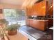 Well-lit kitchen with sliding doors to a deck and modern appliances that open to the backyard at 2535 Fairfax Dr, Gastonia, NC 28054